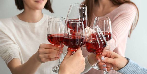 Friends clinking glasses of tasty wine at party, closeup - Photo, Image
