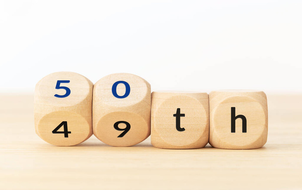 Turning 50 years old concept. Text on wooden blocks and changing dices. Copy space - Photo, Image