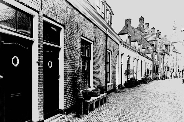 Tyypillisiä hollantilaisia tiilitaloja Hollannissa. Street View polkupyörät pysäköity historialliseen keskustaan Amersfoort Alankomaissa. Musta ja valkoinen kuva
 - Valokuva, kuva