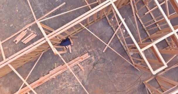 Under construction timber frame house with wooden beam framework on stick built house - Footage, Video