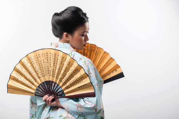 Japanese woman with traditional fan - 写真・画像