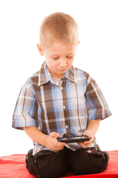 Little boy playing games on smartphone - Φωτογραφία, εικόνα