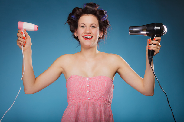 Girl holding hairdreyers - Foto, Bild