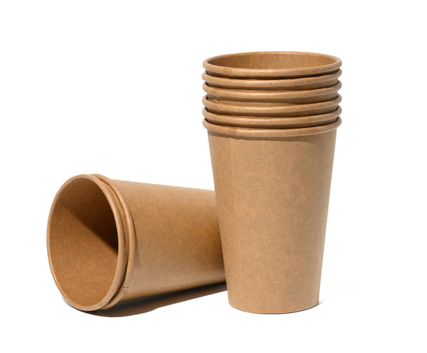 Empty brown paper disposable cups on a white background, concept eco-friendly, zero waste  - Photo, Image