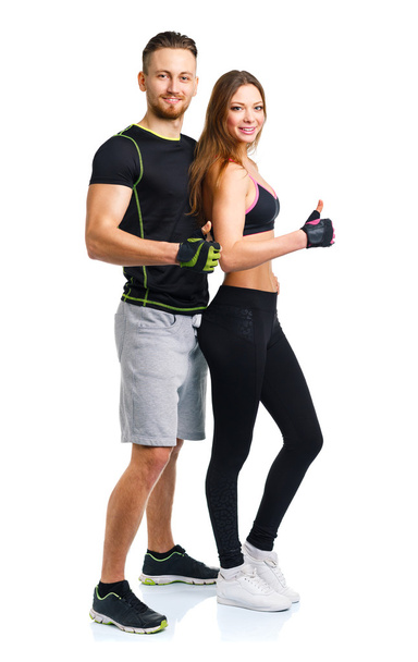 Athletic man and woman after fitness exercise with a finger up o - 写真・画像
