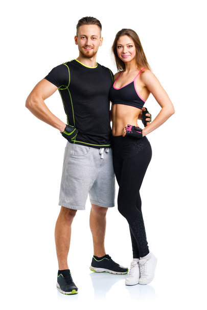 Athletic man and woman after fitness exercise on the white - Foto, imagen