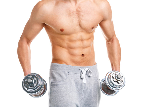 Athletic man with dumbbells on the white - Фото, зображення