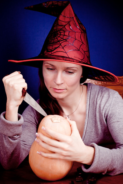 Cute witch with pumpkin - 写真・画像