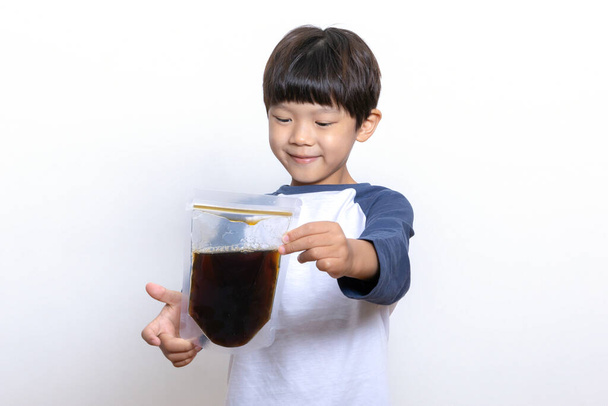 Asian Korean child holding oriental medicine - Fotografie, Obrázek