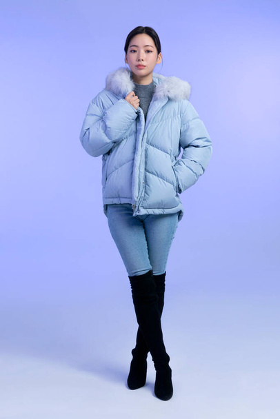beautiful young Korean Asian woman portrait studio photo in winter skin beauty and cosmetics concept, weared padded - Fotó, kép