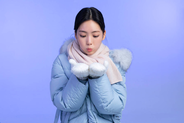 beautiful young Korean Asian woman portrait studio photo in winter skin beauty and cosmetics concept, breathing - Фото, изображение