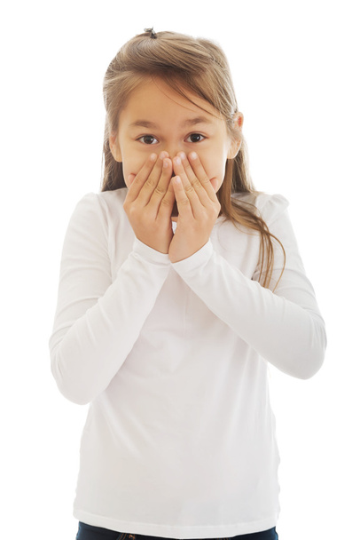 Girl covered her mouth with her hands - 写真・画像