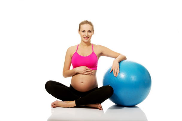Pregnant woman with gymnastic ball - Фото, изображение