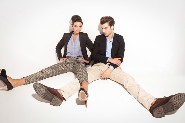 young fashion couple relaxing on studio background - Photo, Image