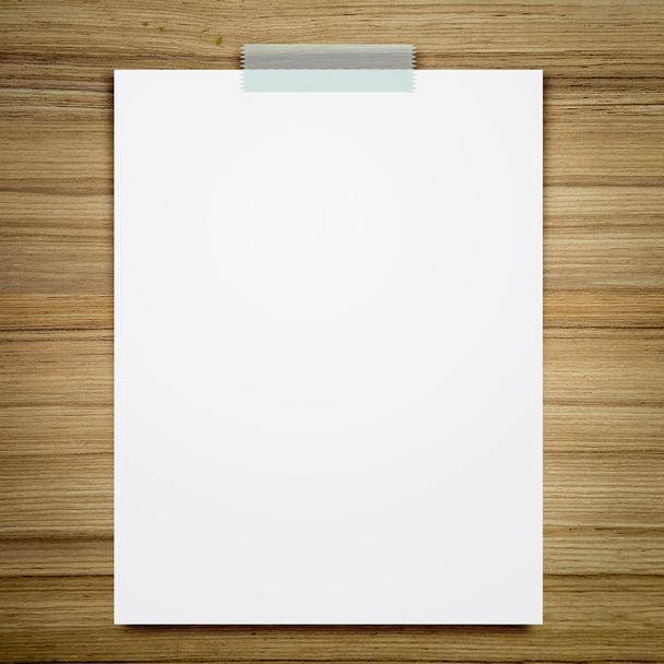 Empty white paper sheet stick on wood background. - Φωτογραφία, εικόνα