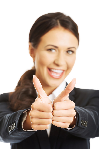 Businesswoman showing thumbs up sign - Photo, image