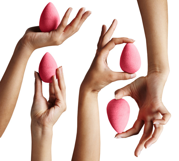 Hands holding makeup sponges - Photo, Image