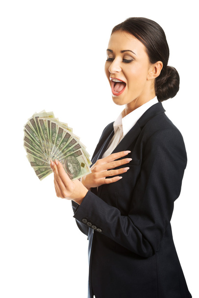 Businesswoman holding a clip of polish money - Фото, зображення