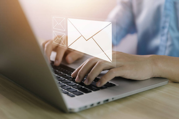Businessman sending a letter from a computer. electronic mail concept is online communication on the Internet network Receiving and sending information or messages in digital technology - Photo, image
