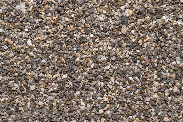 Road and plaster grit, loose chippings, crushed stone, surface, from above. Dry lime- and iron-free quartz sand, used as spreading grit, or as an aggregate for concrete ballast, plaster and masonry. - Photo, Image
