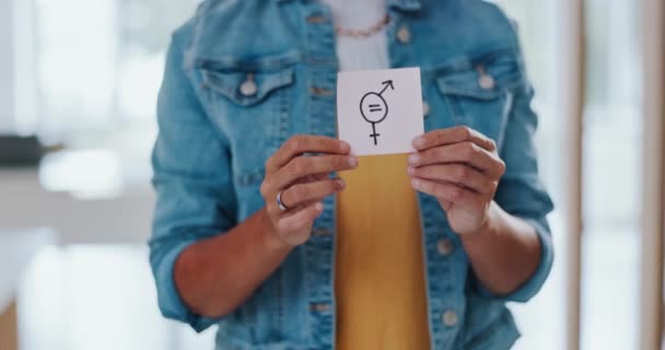 Gender equality, pay gap and woman with a sign in the office with a female and male symbol. Business, equity and girl employee with a feminism card in protest for equal salary, opportunity and equity. - Záběry, video