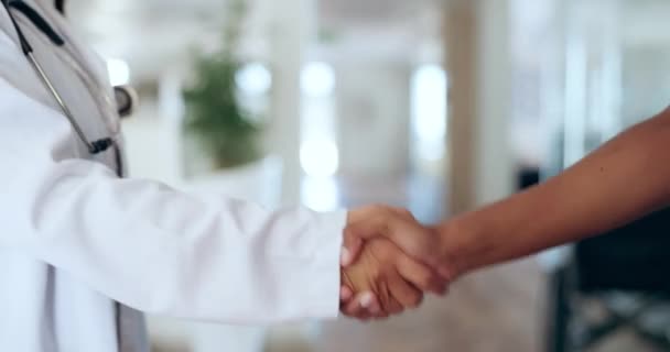 Handshake closeup, doctor and hospital for agreement, success or healthcare with vision, motivation or work. Nurse, medic and shaking hands for teamwork, congratulations or together for team building. - Footage, Video