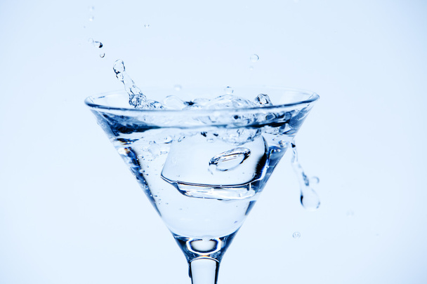 Martini splash on blue - Foto, imagen