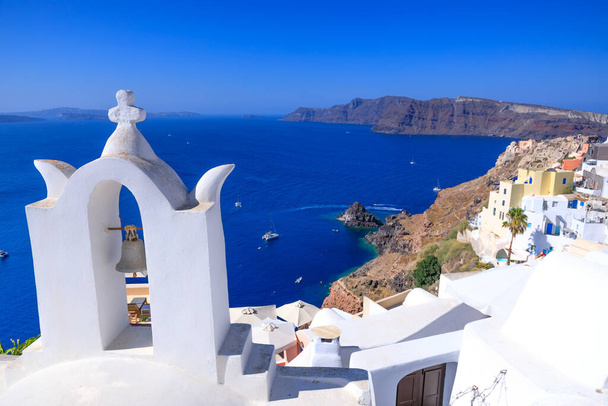 View of the bell tower of the Greek Church of Oia, Santorini. - Фото, изображение