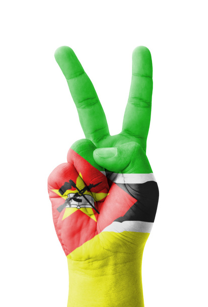Hand making the V sign, Mozambique flag painted as symbol of vic - Photo, Image