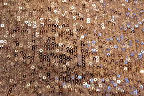 Beige sequin pattern of warm colour. Concept of party and glamour. - Photo, Image