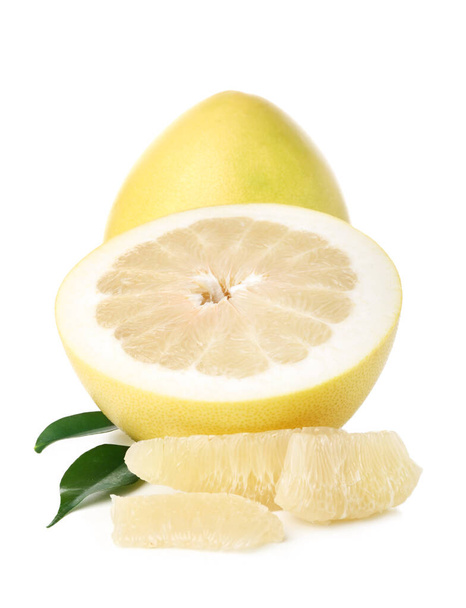Whole and cut sweet ripe pomelo fruits with slices on white background - Photo, Image