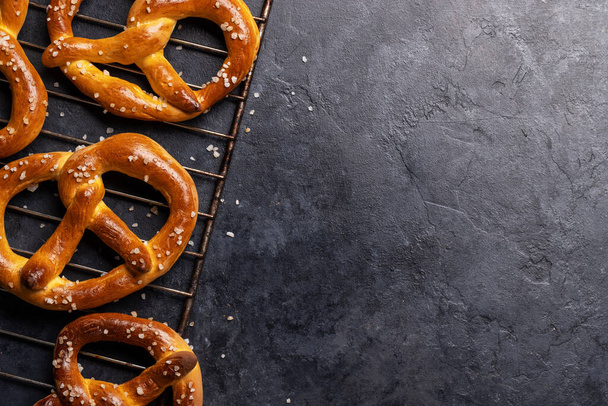 Freshly baked homemade pretzels. Flat lay with copy space - Photo, Image