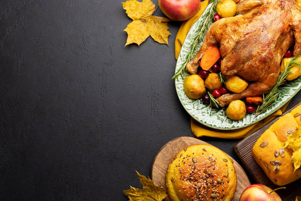 Thanksgiving turkey, apple pie and pumpkin bread on rustic table with copy space. Flat lay - Photo, Image