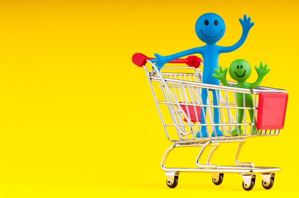 Happy family with shopping cart - Photo, Image