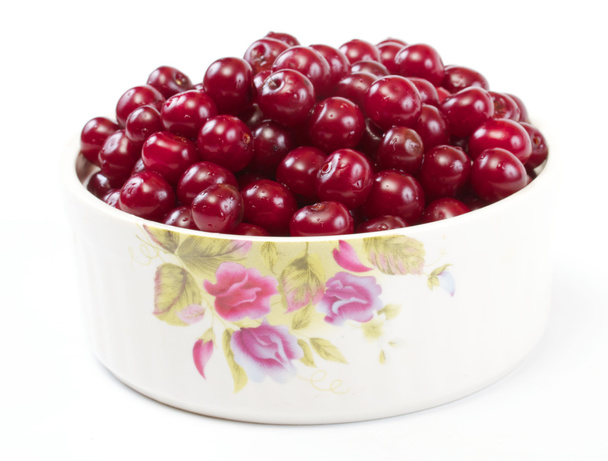 Bowl with ripe cherries. Isolated on a white background. - Photo, Image