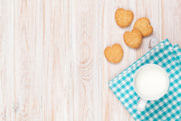 Cup of milk and heart shaped cookies - Photo, Image