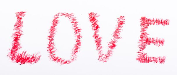 Potlood getekend liefde woord met een rode kleur - Foto, afbeelding