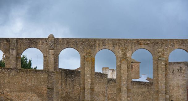 beautiful ancient architecture in Evora, Portugal. Evora aqueduct, Agua de Prata Aqueduct - Photo, Image