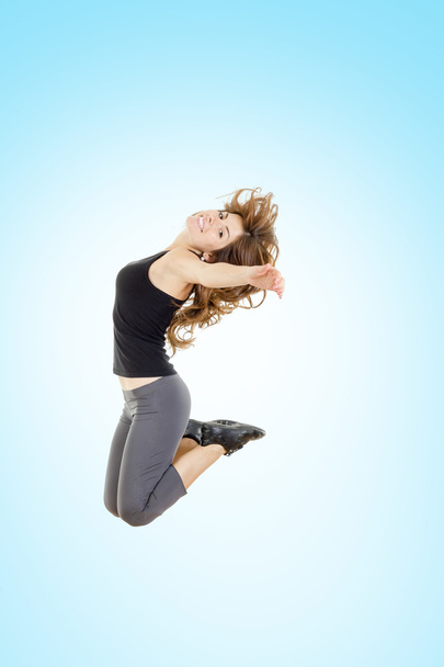 Weight loss fitness woman jumping of joy - Foto, Imagen