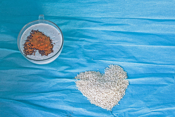 sesame milk with a kerob on a blue background - Photo, Image
