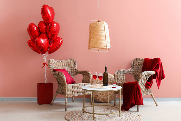 Interior of living room with armchairs, engagement ring and red balloons for Valentine's Day - Foto, imagen