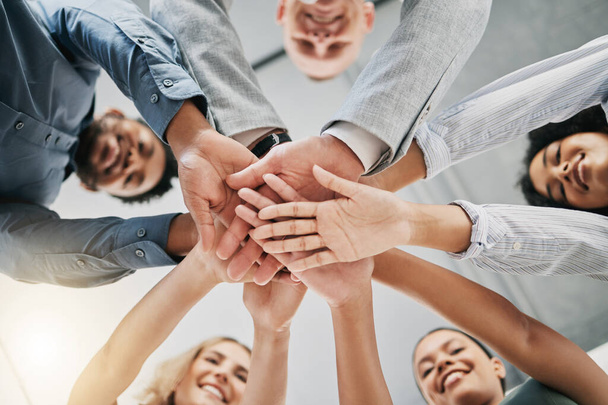 Team building, hands or happy business people with support, mission or goals for success in office building. Low angle, meeting or employees in partnership working with hope, team work or motivation. - Photo, image