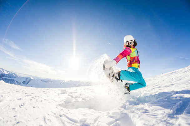Girl having fun on her snowboard - Fotografie, Obrázek