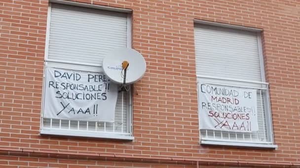 Banners on the buildings affected by line 7B of the San Fernando de Henares metro, in the Community of Madrid, Spain. Solutions already with the evicted neighbors. Video. - Footage, Video