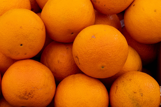 Background with stack of tangelo oranges. - Foto, Imagen