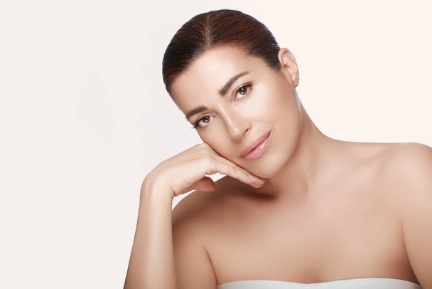 Beauty and Skincare Concept. Beautiful natural woman face with nude makeup on a flawless skin on a panorama banner with lateral copyspace. - Zdjęcie, obraz