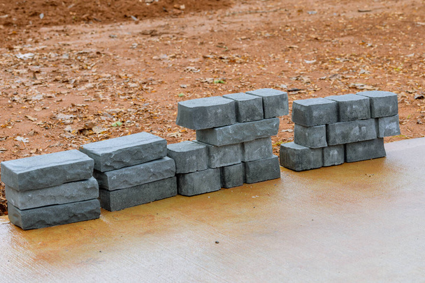 concrete blocks on the ground cement grey new stack - Foto, imagen