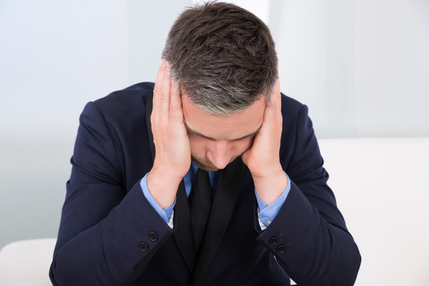 Businessman Suffering From Headache - Фото, изображение
