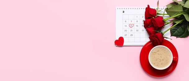 Calendar with marked date of Valentine's Day, red roses and cup of latte on pink background with space for text - Photo, Image