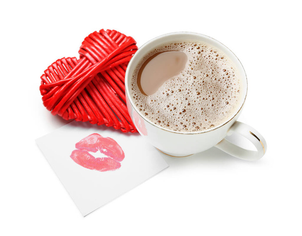 Cup of latte with heart and lipstick kiss on white background. Valentine's Day celebration - Zdjęcie, obraz